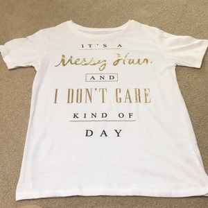 Gold and black lettered white t-shirt